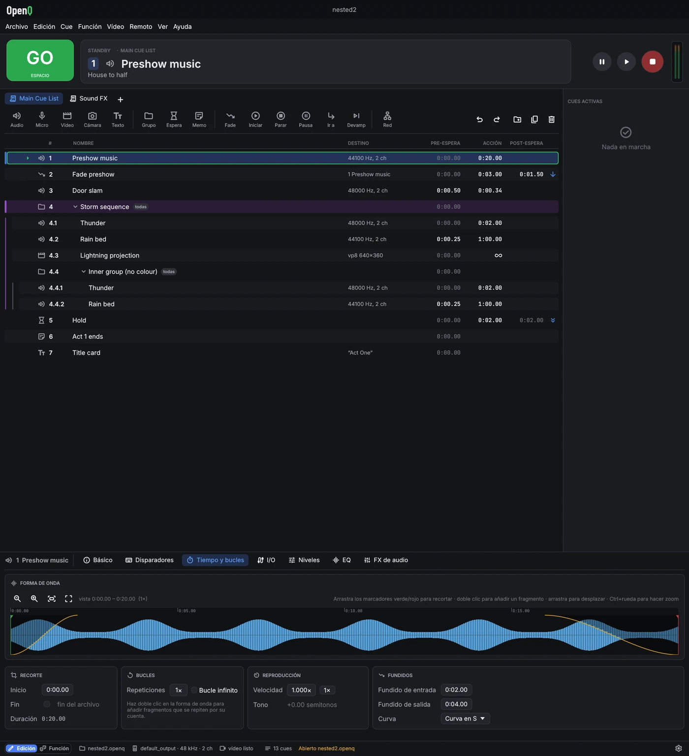 Ventana principal de OpenQ en modo edición: botón GO, tarjeta de espera, transporte, medidores, barra de herramientas, lista de cues e inspector.